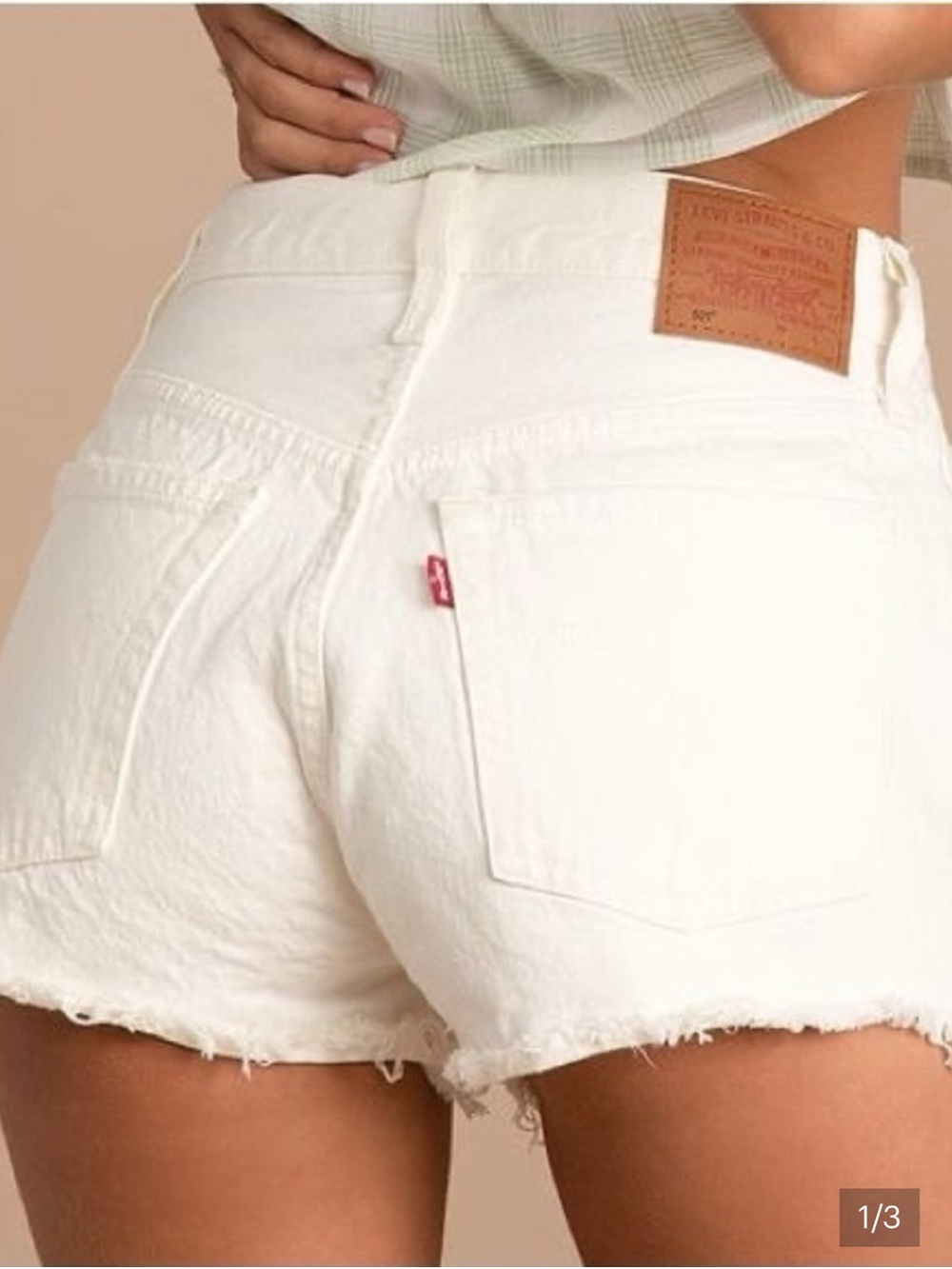 Levi's White Denim Cutoff Shorts with Frayed Hem